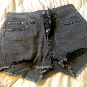 Levi’s 501 Mid Rise distressed black cut off shorts
